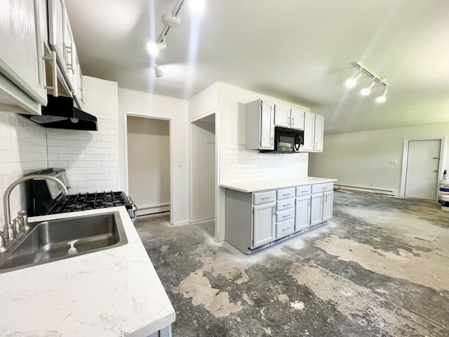 265 Marina Dr, Stratford, CT 06614 - kitchen featuring track lighting, black microwave, under cabinet range hood, a sink, and tasteful backsplash