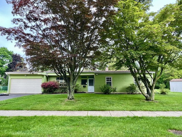 265 Marina Dr, Stratford, CT 06614 - ranch-style house featuring an attached garage, a front lawn, and driveway