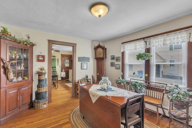 16 Reservoir Rd, Vernon, CT 06066 - dining space with light wood-style floors and a ceiling fan