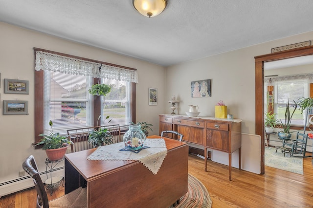 16 Reservoir Rd, Vernon, CT 06066 - dining space featuring healthy amount of natural light, light wood-type flooring, and baseboard heating