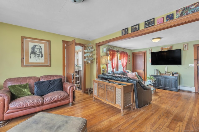16 Reservoir Rd, Vernon, CT 06066 - living area featuring a baseboard radiator, wood finished floors, and baseboards