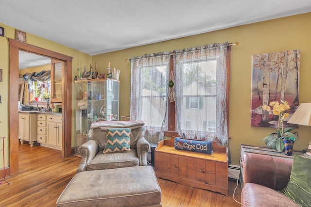 16 Reservoir Rd, Vernon, CT 06066 - sitting room with wood finished floors and baseboard heating