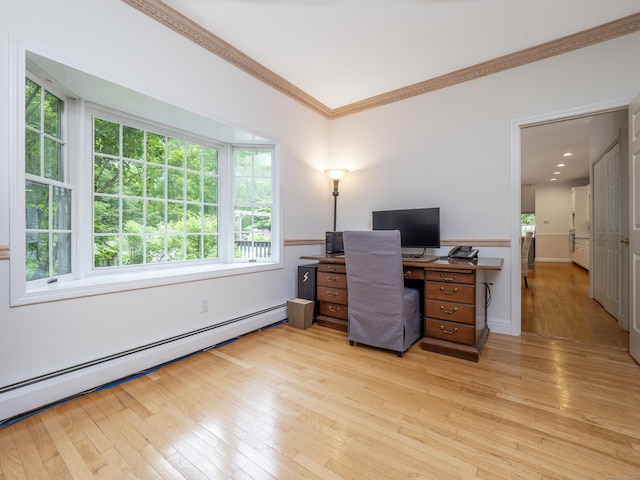 office with baseboard heating, ornamental molding, and light wood-type flooring
