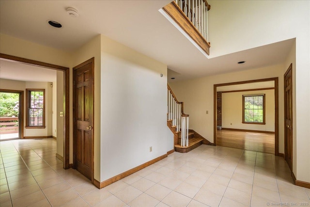 4665 Black Rock Tpke, Fairfield, CT 06824 - entrance foyer with plenty of natural light, stairs, and light tile patterned floors