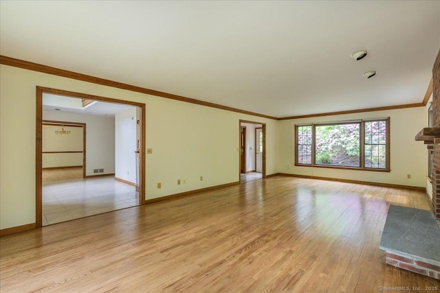 4665 Black Rock Tpke, Fairfield, CT 06824 - spare room featuring baseboards, light wood finished floors, ornamental molding, and a brick fireplace