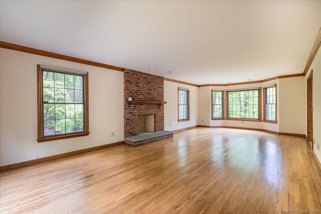 4665 Black Rock Tpke, Fairfield, CT 06824 - unfurnished living room with light wood-type flooring, crown molding, baseboards, and a fireplace
