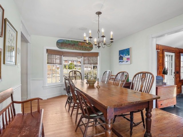 44 Meadow Ridge Dr, Easton, CT 06612 - dining area with wood finished floors, a chandelier, and wainscoting