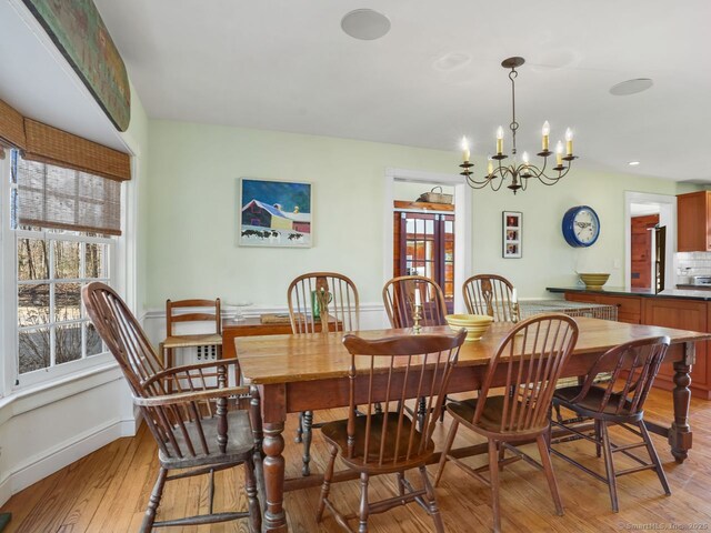 44 Meadow Ridge Dr, Easton, CT 06612 - dining space featuring light wood-style flooring, healthy amount of natural light, a chandelier, and baseboards