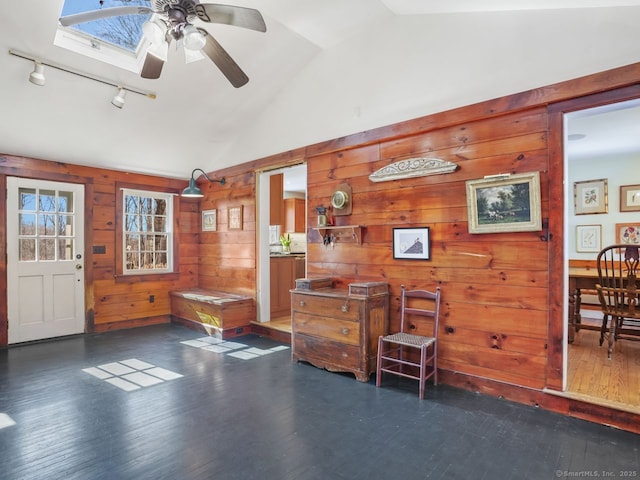 44 Meadow Ridge Dr, Easton, CT 06612 - entrance foyer featuring vaulted ceiling, wood walls, wood finished floors, a ceiling fan, and rail lighting