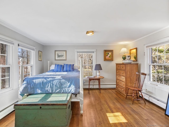 44 Meadow Ridge Dr, Easton, CT 06612 - bedroom with a baseboard radiator, a baseboard heating unit, wood-type flooring, and ornamental molding