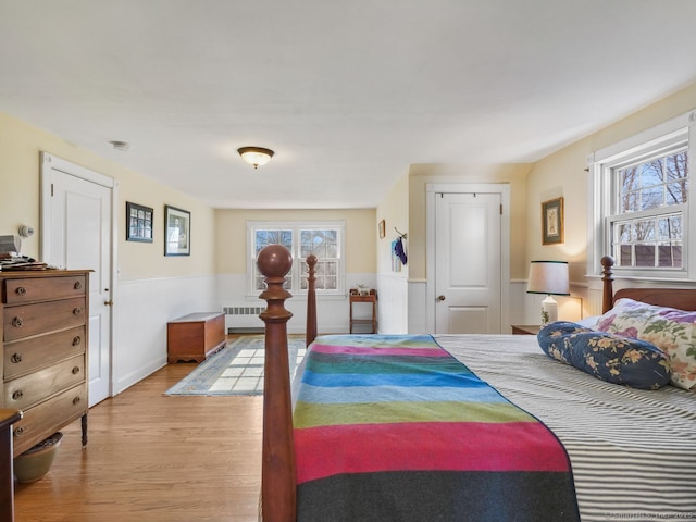 44 Meadow Ridge Dr, Easton, CT 06612 - bedroom featuring radiator, wainscoting, multiple windows, and wood finished floors