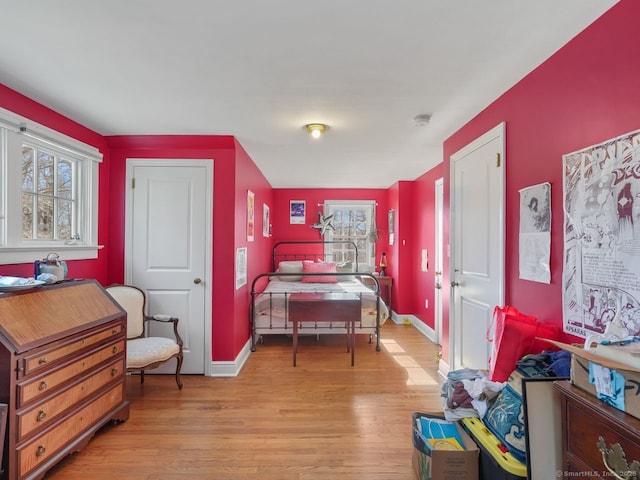 44 Meadow Ridge Dr, Easton, CT 06612 - bedroom with multiple windows, light wood-style floors, and baseboards