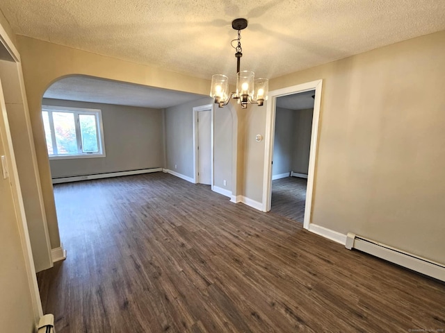354 Clinton St, New Britain, CT 06053 - unfurnished room featuring a baseboard heating unit, dark wood-style floors, a textured ceiling, arched walkways, and a chandelier