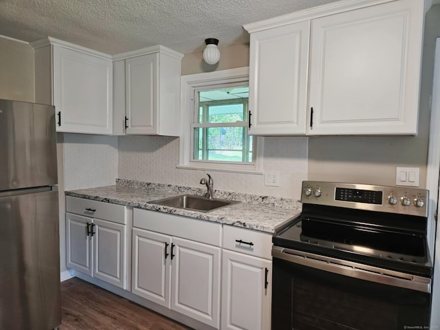 354 Clinton St, New Britain, CT 06053 - kitchen featuring appliances with stainless steel finishes, a sink, white cabinets, dark wood-type flooring, and a textured ceiling