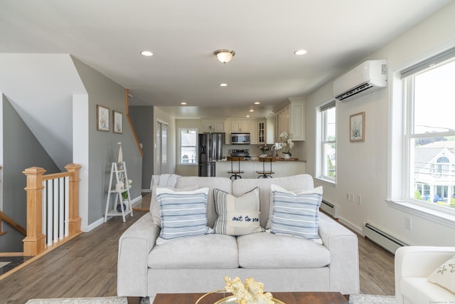 22 Shore Rd, East Lyme, CT 06357 - living room with baseboard heating, plenty of natural light, a wall mounted air conditioner, wood finished floors, and recessed lighting