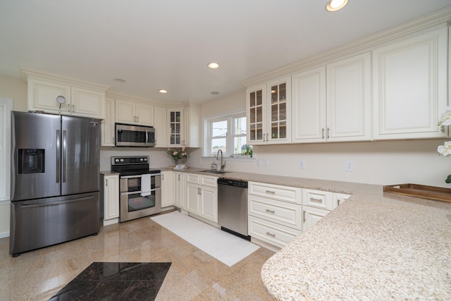 22 Shore Rd, East Lyme, CT 06357 - kitchen with appliances with stainless steel finishes, recessed lighting, glass insert cabinets, light countertops, and granite floors