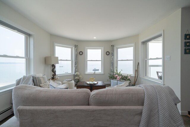 22 Shore Rd, East Lyme, CT 06357 - living area with a baseboard heating unit and plenty of natural light