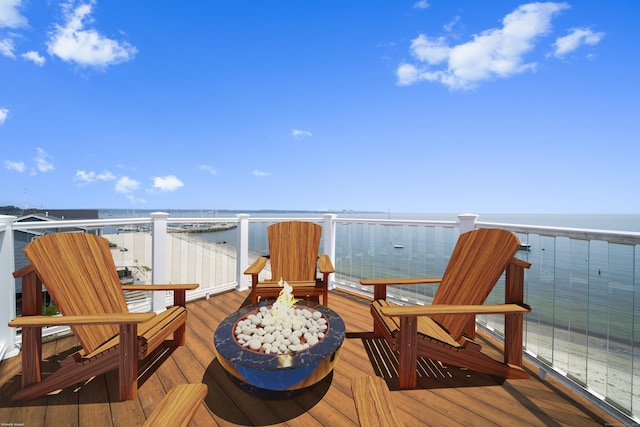 22 Shore Rd, East Lyme, CT 06357 - wooden terrace featuring a fire pit and a water view