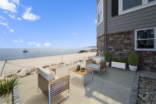 22 Shore Rd, East Lyme, CT 06357 - view of patio with view of water and beach and an outdoor living space