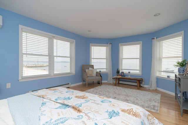 22 Shore Rd, East Lyme, CT 06357 - bedroom featuring a baseboard radiator and light wood finished floors