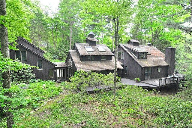 21 Bexley Ct, Goshen, CT 06756 - back of property with a chimney and a deck