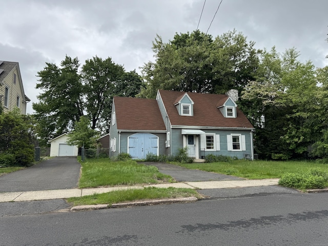 31 E Broad St, Plainville, CT 06062 - cape cod-style house featuring an outdoor structure, a detached garage, and a chimney