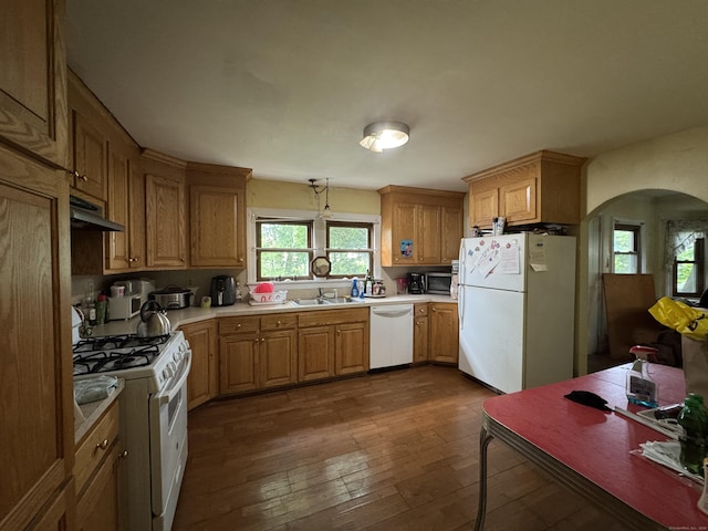 31 E Broad St, Plainville, CT 06062 - kitchen with white appliances, arched walkways, a sink, dark wood-type flooring, and light countertops