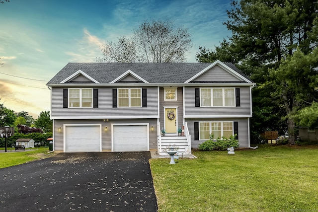 20 Jeffrey Ln, Southington, CT 06451 - bi-level home featuring driveway, a front yard, a garage, and roof with shingles