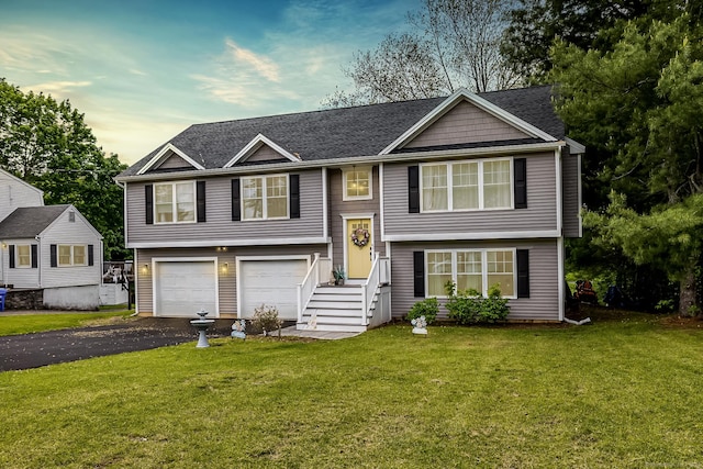 20 Jeffrey Ln, Southington, CT 06451 - raised ranch featuring driveway, a front yard, and a garage