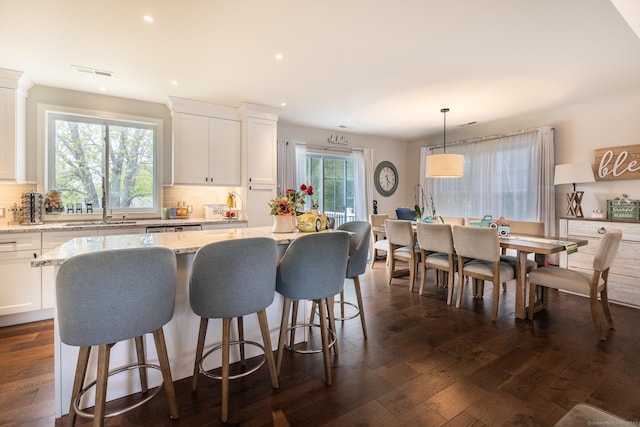 20 Jeffrey Ln, Southington, CT 06451 - kitchen featuring tasteful backsplash, a kitchen island, light stone counters, white cabinetry, and recessed lighting