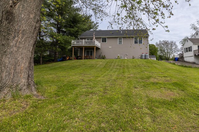 20 Jeffrey Ln, Southington, CT 06451 - rear view of property with a wooden deck and a lawn