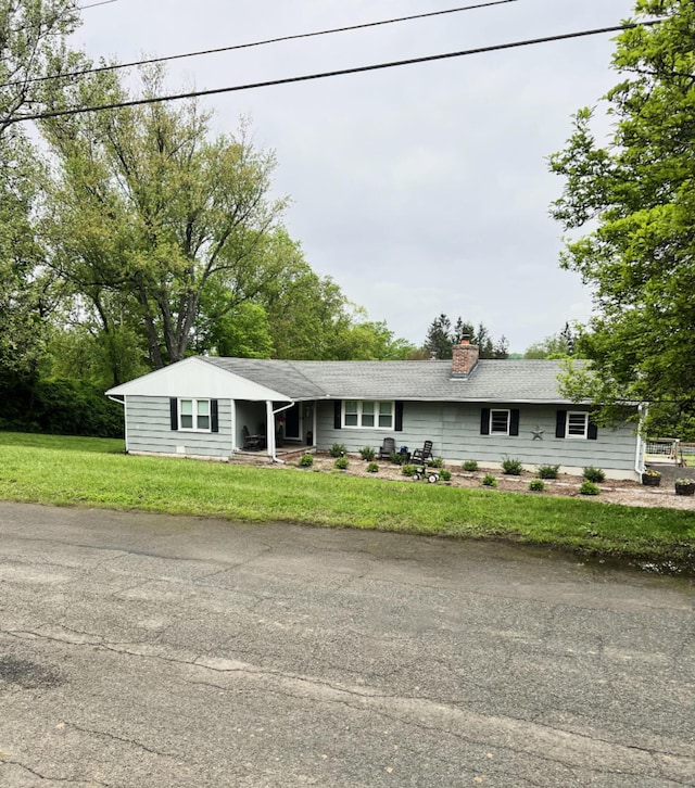 49 Warner Rd, Bridgewater, CT 06752 - single story home featuring a chimney and a front yard