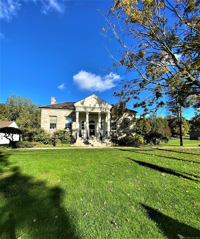 49 Warner Rd, Bridgewater, CT 06752 - greek revival inspired property featuring a chimney, a front lawn, and stone siding