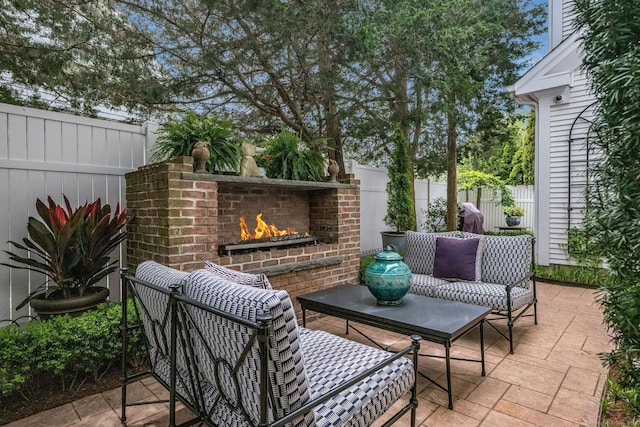 3 Evarts Ln Unit 3, Madison, CT 06443 - fenced backyard with an outdoor brick fireplace and a patio area