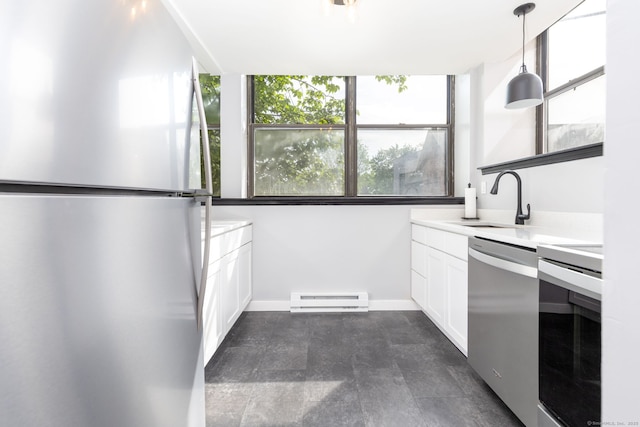 201 College St Unit 3, Middletown, CT 06457 - kitchen featuring stainless steel appliances, a sink, baseboard heating, white cabinets, and light countertops