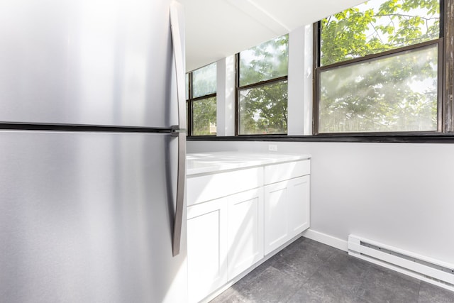 201 College St Unit 3, Middletown, CT 06457 - kitchen featuring freestanding refrigerator, a baseboard heating unit, white cabinetry, light countertops, and baseboards