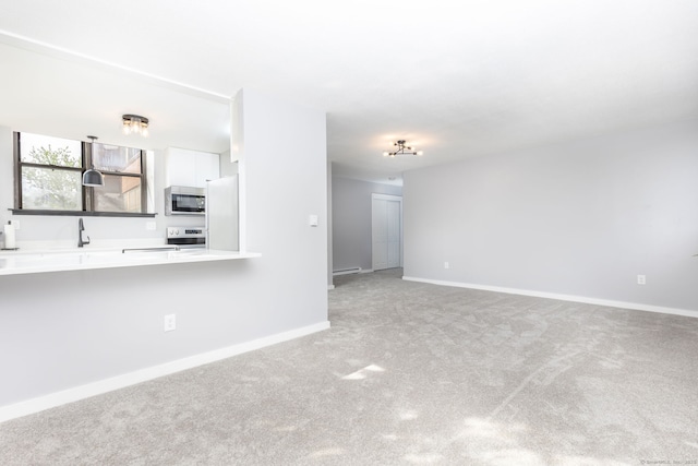 201 College St Unit 3, Middletown, CT 06457 - unfurnished living room featuring light carpet, baseboards, and baseboard heating