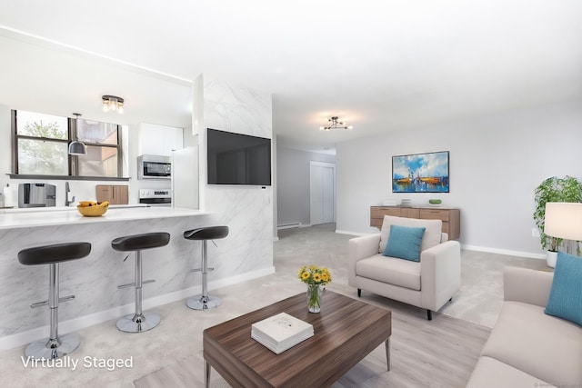 201 College St Unit 3, Middletown, CT 06457 - living room with baseboards, a baseboard heating unit, and light wood finished floors