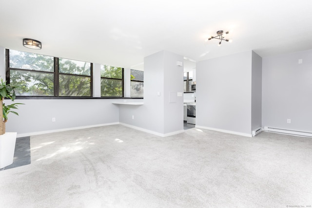 201 College St Unit 3, Middletown, CT 06457 - unfurnished living room with carpet floors, baseboards, and a baseboard heating unit