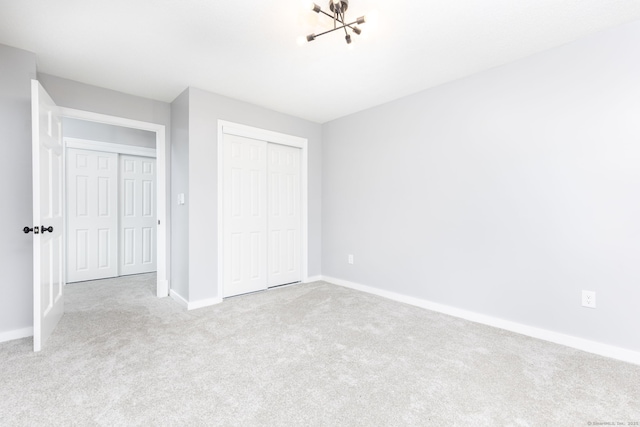 201 College St Unit 3, Middletown, CT 06457 - unfurnished bedroom featuring carpet, baseboards, a closet, and a chandelier
