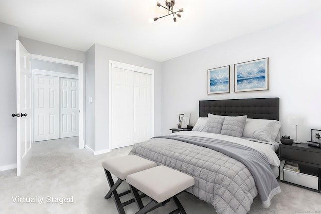 201 College St Unit 3, Middletown, CT 06457 - bedroom featuring a closet, light carpet, baseboards, and a chandelier