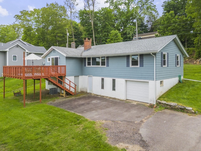 114 Wildwood Rd, East Haddam, CT 06415 - single story home with driveway, a chimney, a deck, roof with shingles, and a front lawn