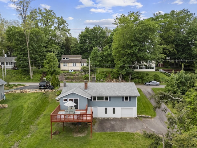 114 Wildwood Rd, East Haddam, CT 06415 - back of house featuring a wooden deck, a chimney, and a yard