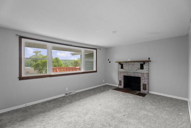 114 Wildwood Rd, East Haddam, CT 06415 - unfurnished living room featuring carpet, a fireplace, and baseboards