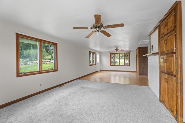 114 Wildwood Rd, East Haddam, CT 06415 - unfurnished living room with light carpet, ceiling fan, and baseboards