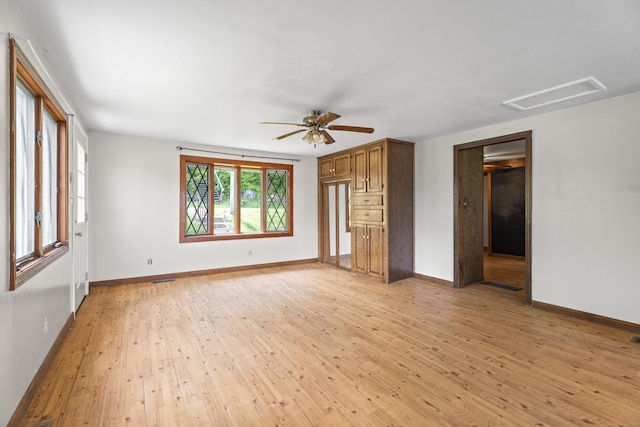 114 Wildwood Rd, East Haddam, CT 06415 - unfurnished living room with light wood-style flooring, baseboards, a ceiling fan, and attic access