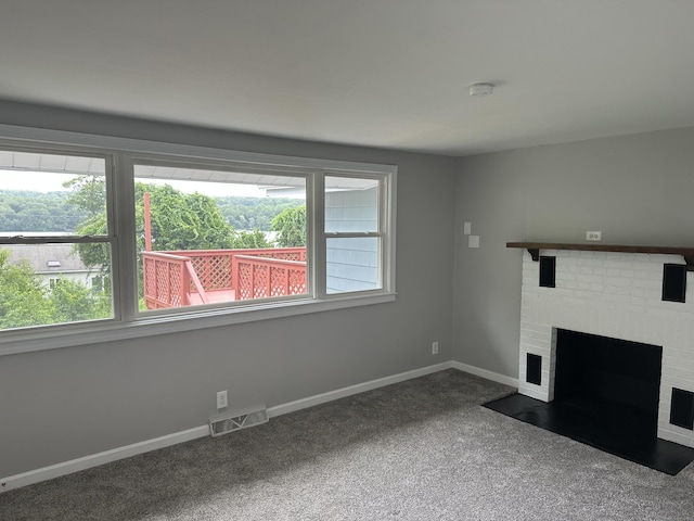114 Wildwood Rd, East Haddam, CT 06415 - unfurnished living room featuring carpet flooring and a fireplace
