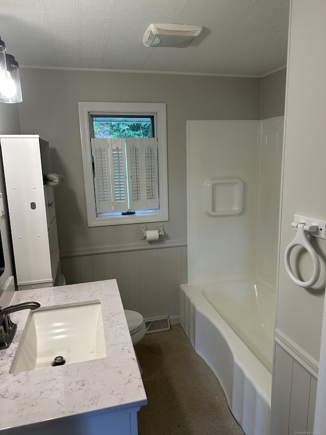 114 Wildwood Rd, East Haddam, CT 06415 - bathroom featuring vanity, bathtub / shower combination, ornamental molding, and wainscoting