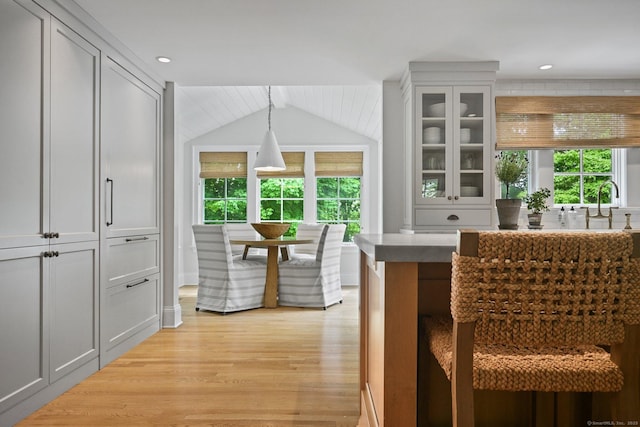 4 Budner Ln, Westport, CT 06880 - bar area with light wood finished floors, lofted ceiling, pendant lighting, and recessed lighting