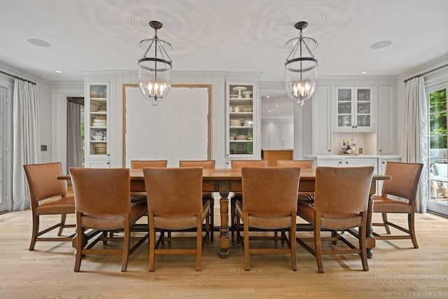 4 Budner Ln, Westport, CT 06880 - dining space featuring ornamental molding, a chandelier, and light wood-type flooring